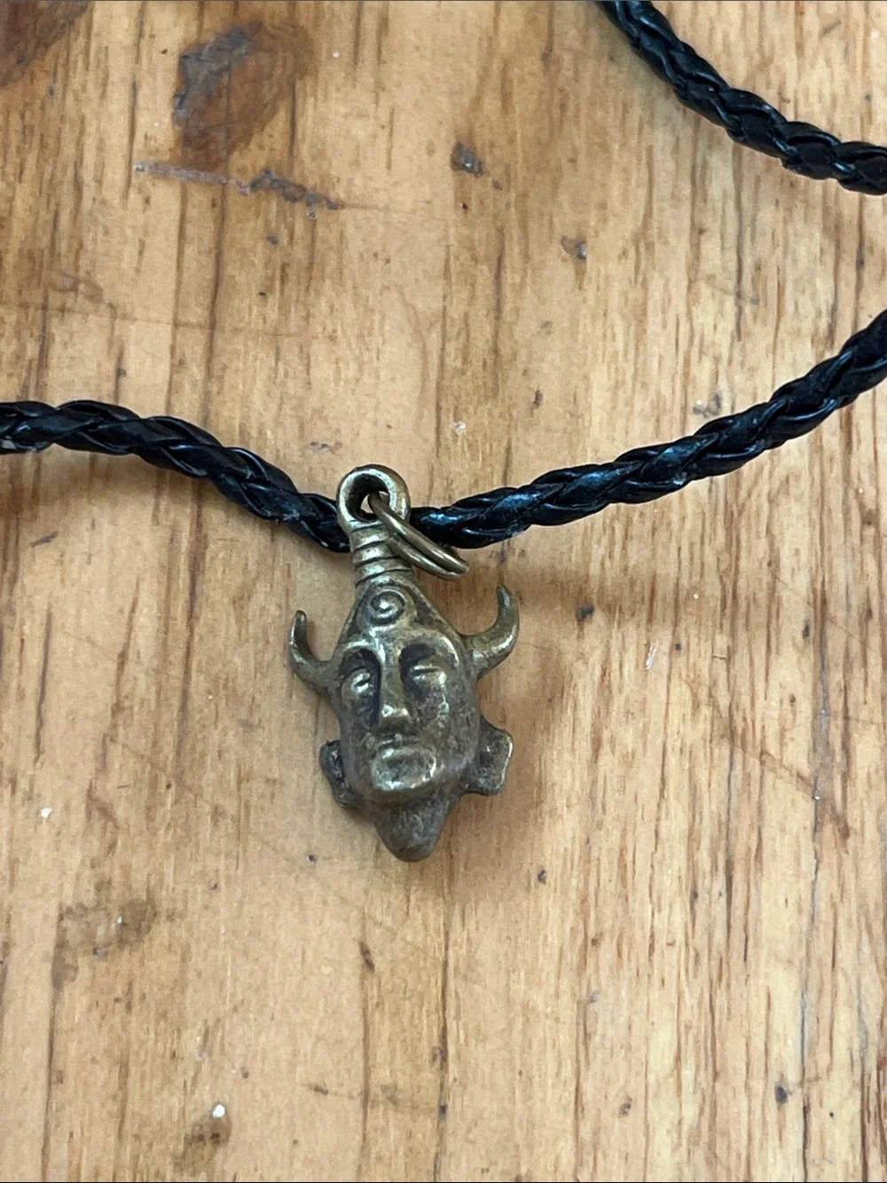Black Braided Cord Necklace with Antique Brass Horned Face Pendant